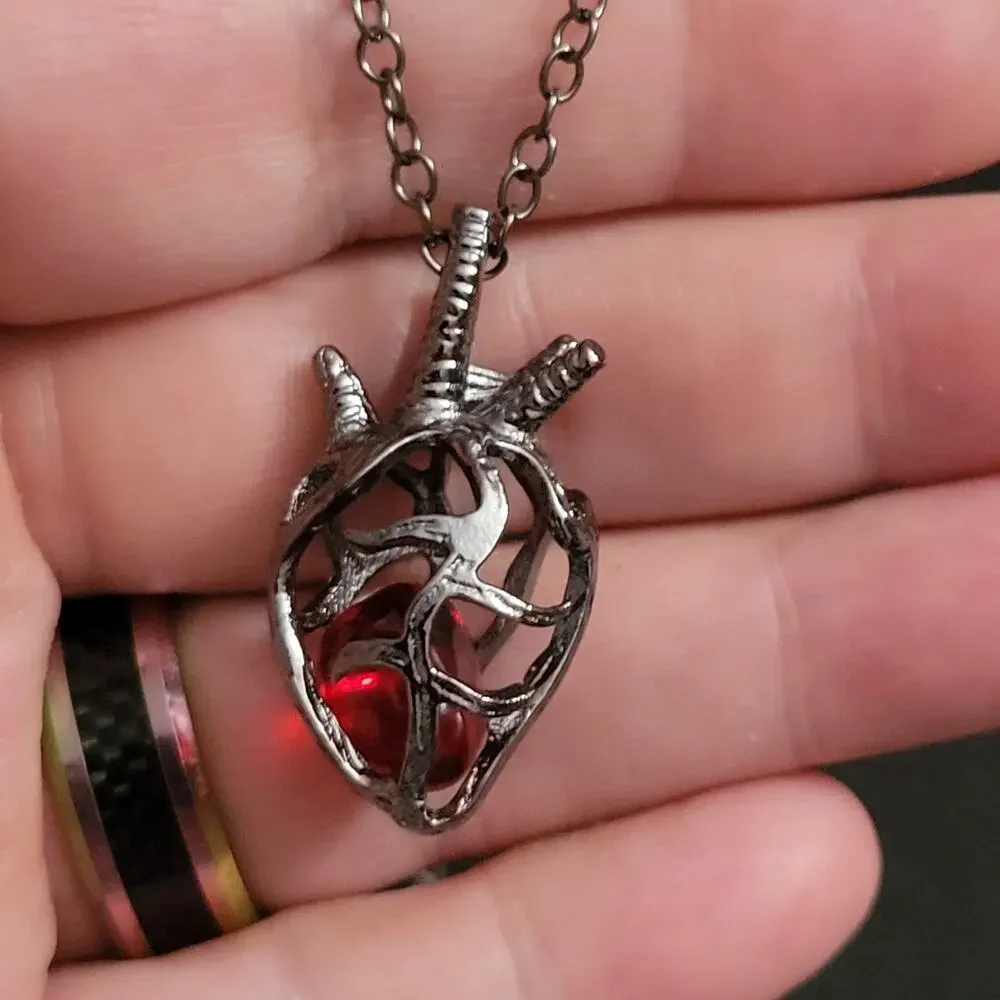 Red & black anatomical heart cage with crystal necklace